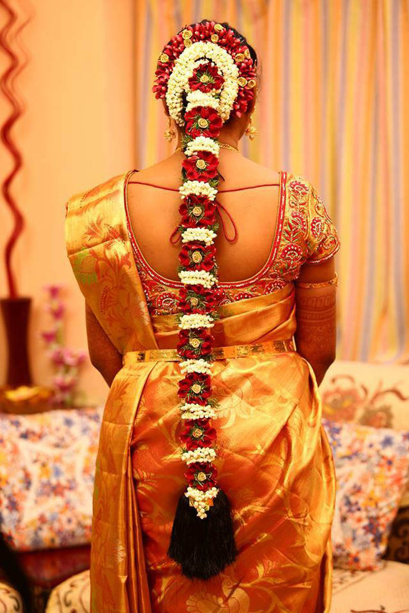 south indian bridal hairstyle with flowers for wedding glamour
