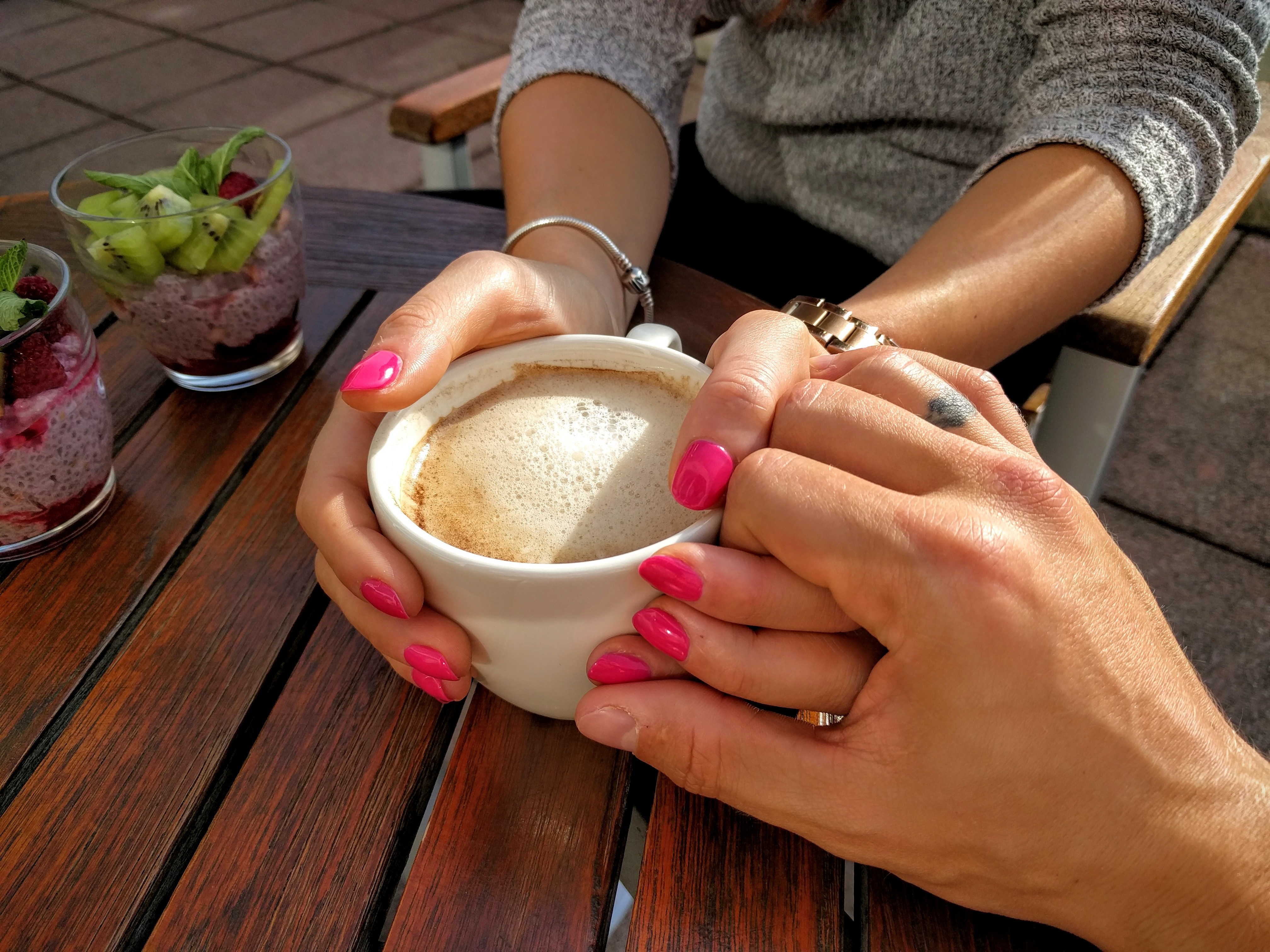 lovers holding coffee cup free stock photo by pexels